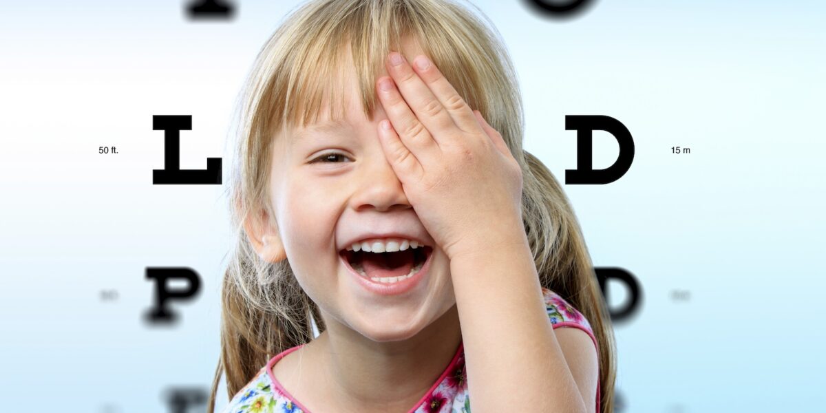 Girl having fun at vision test.